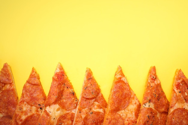 Delicious and fresh pepperoni pizza Lies on a bright and even background in full screen