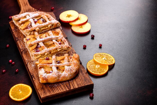 Delicious fresh pie baked with apple, pears and berries. Fresh pastries for delicious breakfast