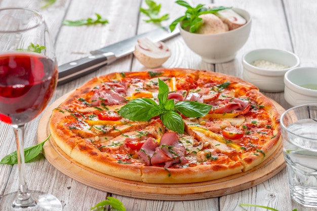 Delicious fresh pizza served on wooden table