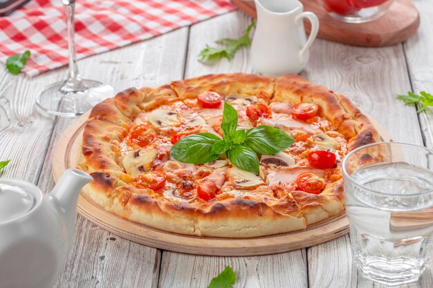 Delicious fresh pizza served on wooden table