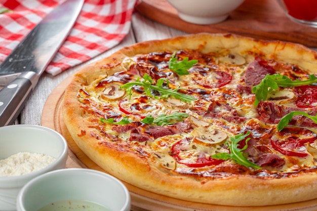 Delicious fresh pizza served on wooden table