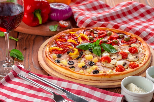 Delicious fresh pizza served on wooden table