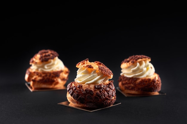 Delicious fresh profiteroles with sweet white cream inside