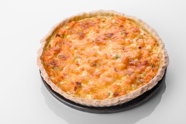 Delicious fresh quiche with broccoli, salmon and cheese