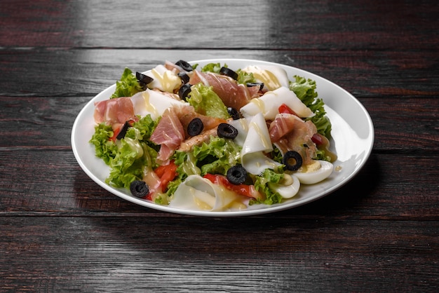 Delicious fresh salad with bacon for the festive table. Preparing for Family Holiday