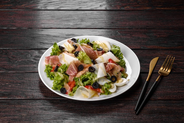 Delicious fresh salad with bacon for the festive table. Preparing for Family Holiday