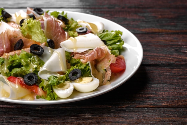 Delicious fresh salad with bacon for the festive table. Preparing for Family Holiday