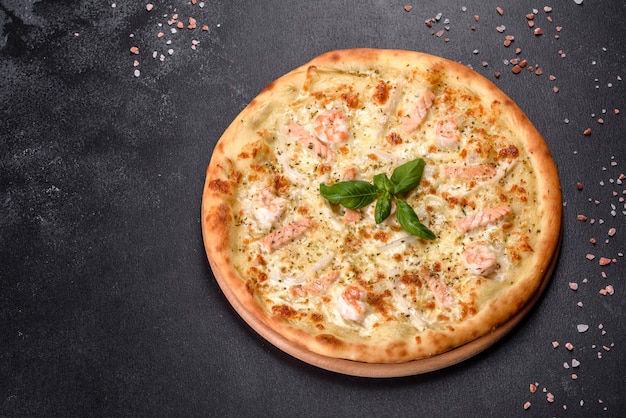 Delicious fresh seafood oven pizza: red fish and shrimp.\
healthy food. italian cuisine