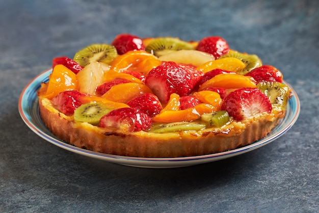 Delicious fresh seasonal fruit tart and cream