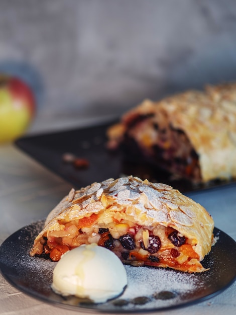 Delicious fresh strudel stuffed with apples and raisins