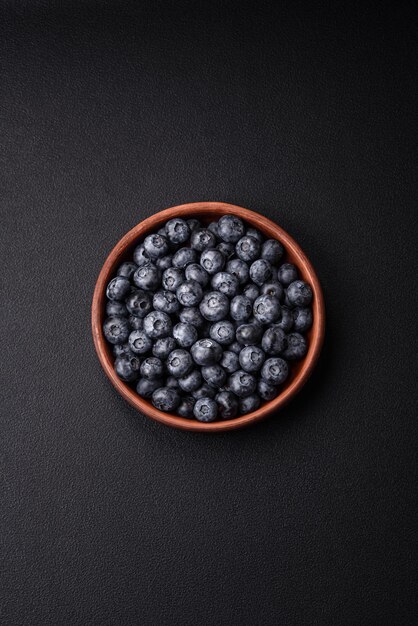 Delicious fresh sweet blueberries in a ceramic bowl Vegan food
