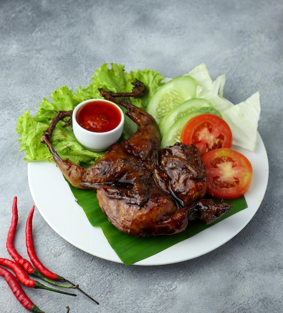 Delicious freshly baked crispy baked chicken is appetizing served on a wooden dish