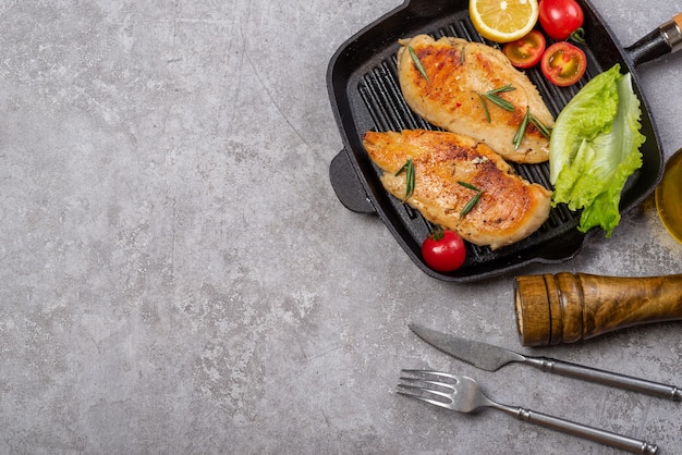 Delicious fried chicken breast and vegetable salad