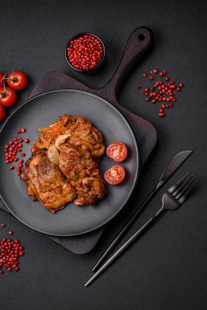 Delicious fried chicken in sauce with onions salt spices and herbs