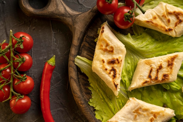 Delicious fried pita bread roll with cottage cheese and herbs