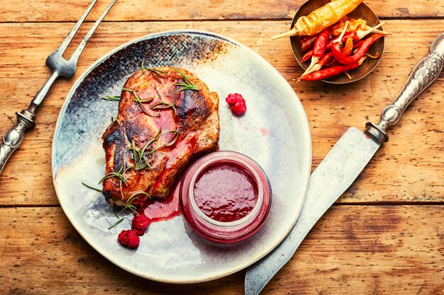 Delicious fried pork with raspberry sauce barbecue