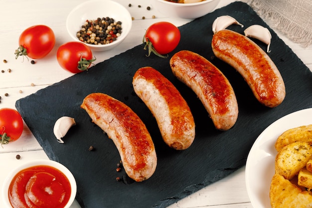 Delicious fried sausages with sauce