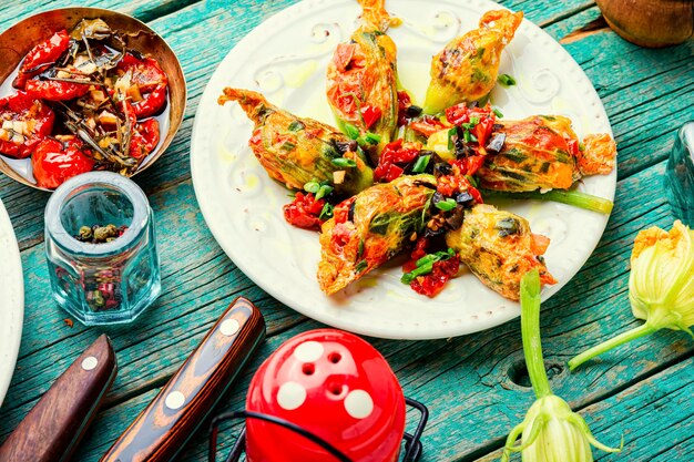 Delicious fried zucchini flowers stuffed with sun-dried tomatoes.Summer food.