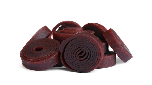 Delicious fruit leather rolls on white background
