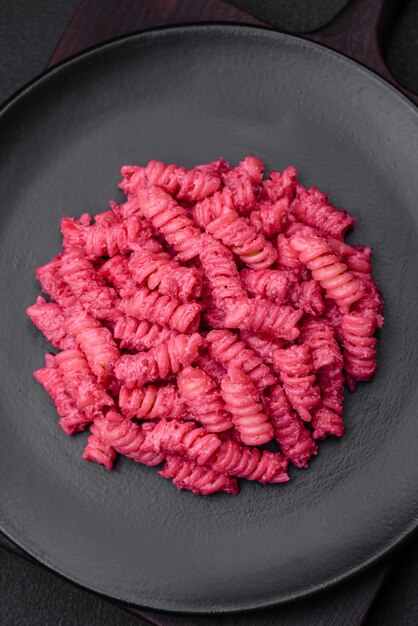 Delicious fusilli pasta with beetroot pesto parmesan salt and spices