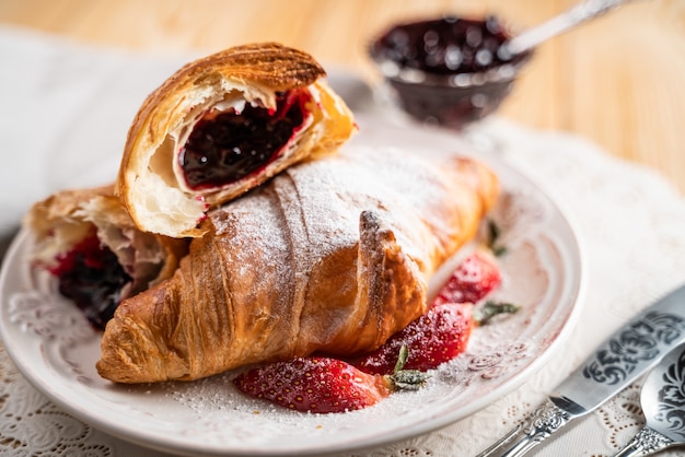 Delicious golden croissants filled with strawberry marmalade.