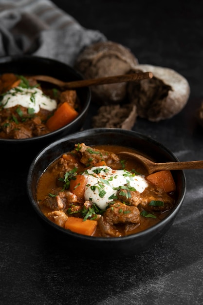 Photo delicious goulash stew on table