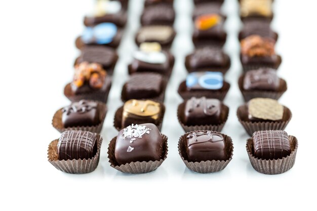 Photo delicious gourmet chocolate truffles hand made by professional chocolatier.