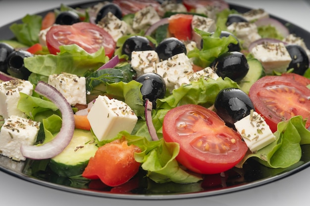 Delicious greek salad on a platter macro detail