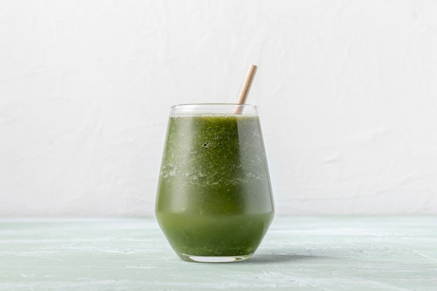 Delicious green smoothie in glass