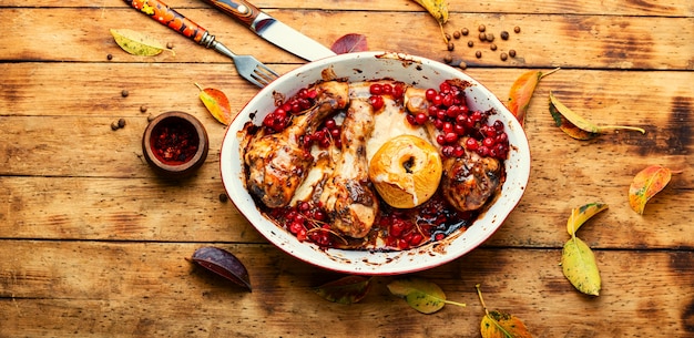 Delicious grilled chicken legs with autumn berries.Chicken drumsticks roasted with viburnum
