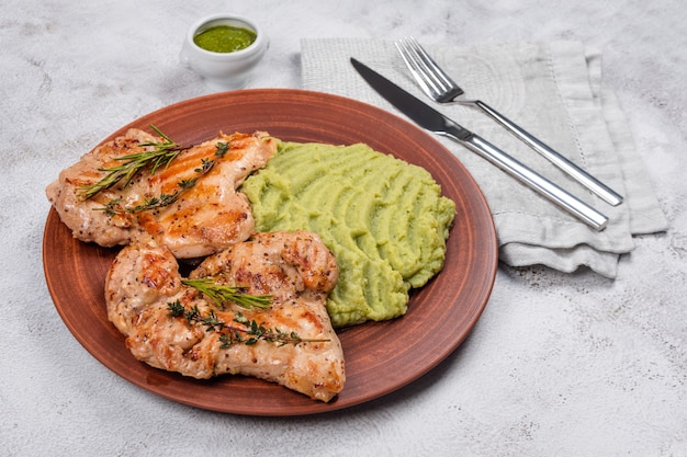 Delicious grilled chicken with herbs and green puree.