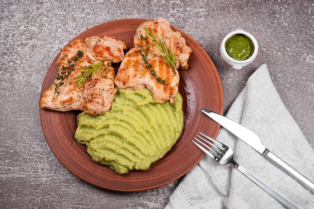 Delicious grilled chicken with herbs and green puree.