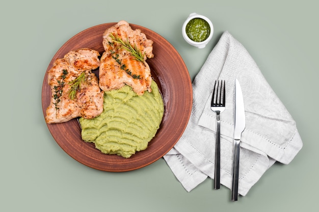 Delicious grilled chicken with herbs and green puree.