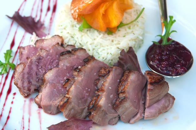 Delicious grilled duck fillets with its garnish