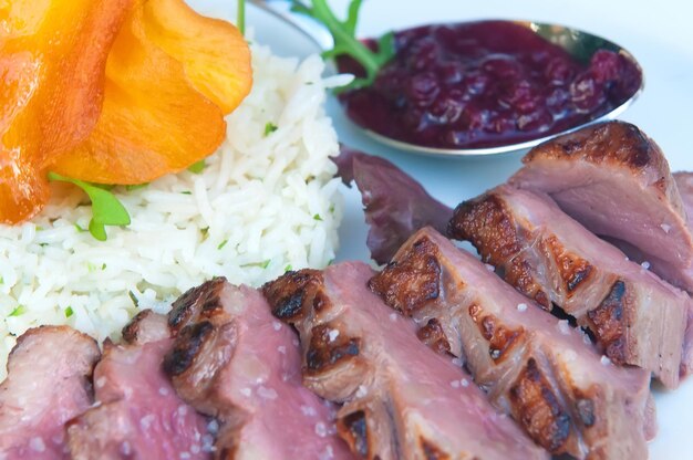 Delicious grilled duck fillets with its garnish