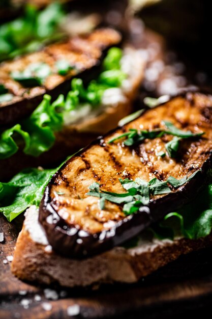 Delicious grilled eggplant sandwich On a wooden background