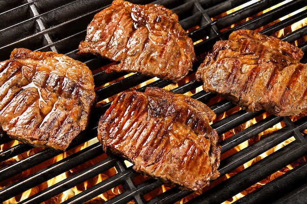 Delicious grilled meat over the coals on a barbecue. Filet.