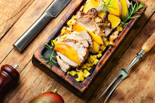 Delicious grilled meat with mango and cheese.