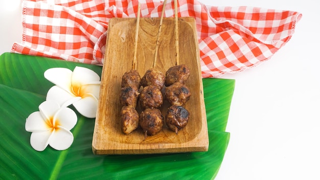 Delicious grilled meatballs bakso bakar Indonesian snack Selective Focus