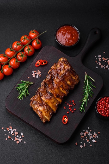 Delicious grilled pork ribs with sauce spices and herbs