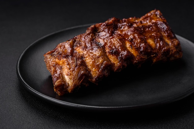 Delicious grilled pork ribs with sauce spices and herbs