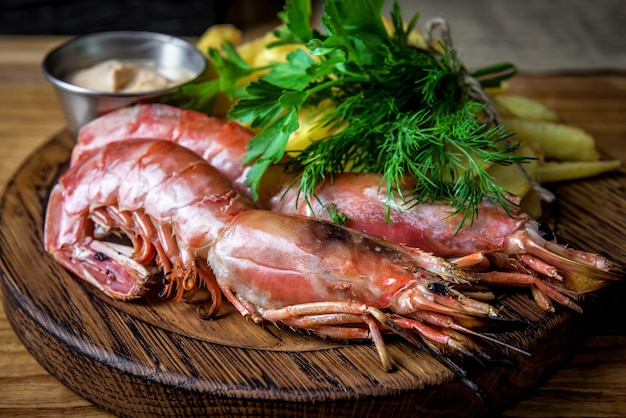 Delicious grilled prawns with green dill