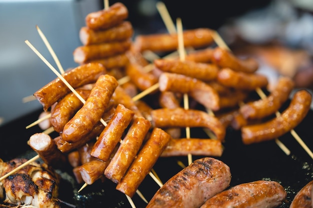 Delicious grilled sausages on a stick