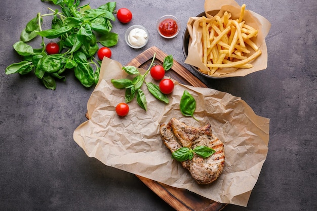 Delicious grilled steak frites on waxed paper