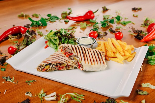 Delicious and grilled wrap sandwich with meat