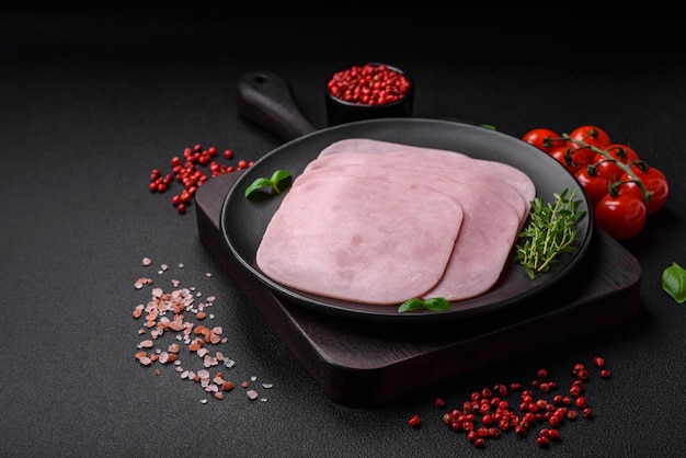 Delicious ham sliced with salt spices and herbs as ingredients for making sandwiches