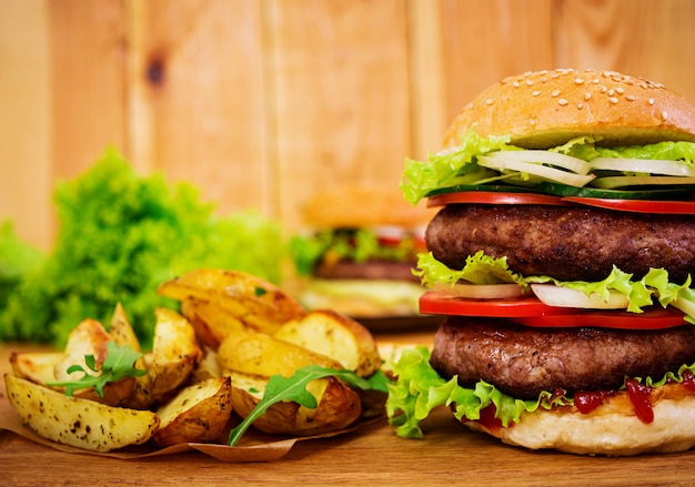 Delicious handmade burger on wooden. Close view