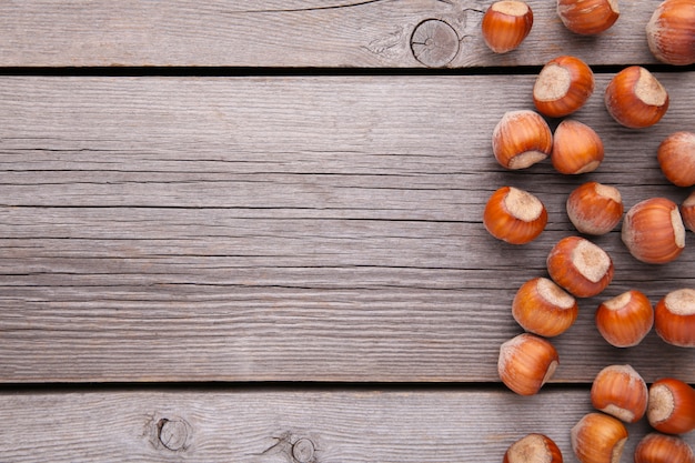 Delicious hazelnut on a grey wooden background