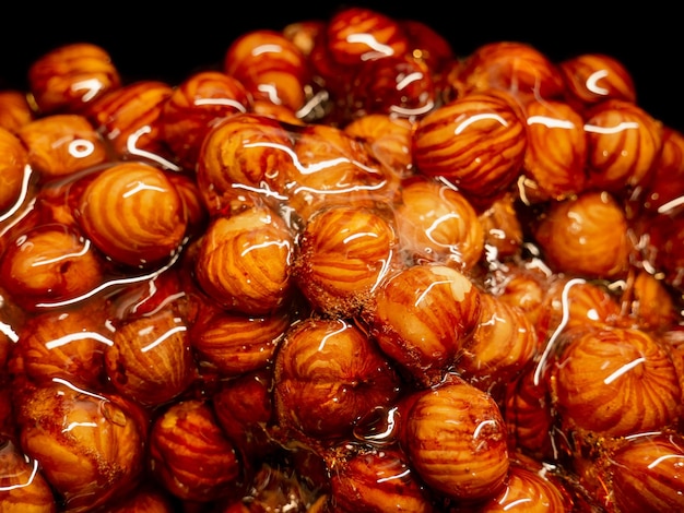 Delicious hazelnut nuts in sugar caramel Preparation of desserts in a from natural ingredients