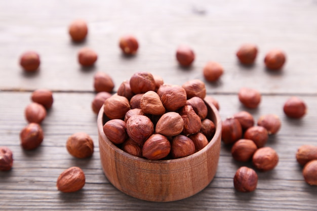 Delicious hazelnut in the wooden bowl